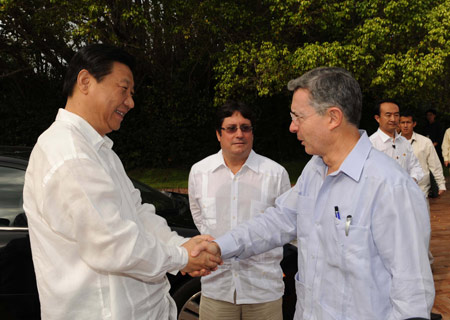 Visiting Chinese Vice President Xi Jinping meets with Colombian President Alvaro Uribe in Cartagena, a port city of Colombia, on Feb. 15, 2009. [Ma Zhancheng/Xinhua]