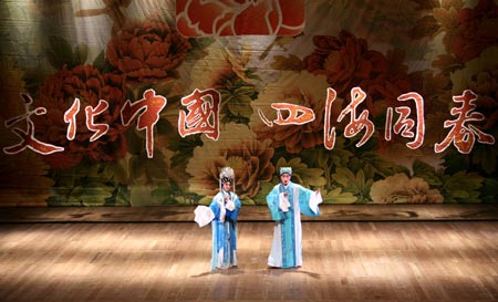 Guangdong Opera actor Wen Ruqing (R) and actress Li Jiayi perform at the theater of the State University of Rio De Janeiro, Brazil, Feb. 14, 2009. A Chinese art troupe sponsored by the Overseas Chinese Affairs Office of the State Council performed here on Saturday to celebrate the Chinese lunar New Year. [Zhang Chuanqi/Xinhua] 