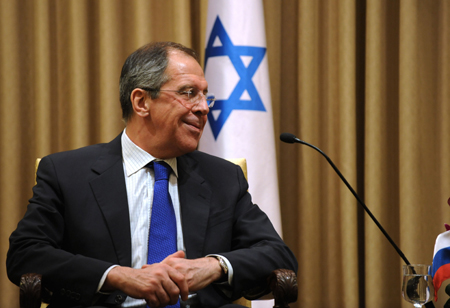 Russian Foreign Minister Sergei Lavrov smiles during a meeting with Israeli President Shimon Peres (unseen in picture) in Jerusalem, Israel, Feb. 15, 2009. [Yin Bogu/Xinhua] 