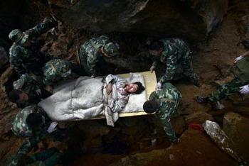 Photo taken by Chen Qinggang for Hangzhou Daily, based in China, on May 14, 2008 shows 'Rescue troops carry earthquake survivor, Beichuan County, China'. The results of the 52nd annual World Press Photo Contest (WPP) were announced in Amsterdam, the Netherlands, Feb. 13, 2009. Chen's image won the first prize of the Spot News Singles category. [Chen Qinggang, Hangzhou Daily/Xinhua/WPP]