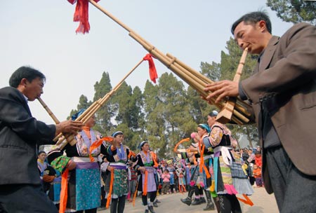 People of Miao ethnic group dance during a cultural activity held in Pingpo Village of Longli County, southwest China&apos;s Guizhou Province, Feb. 14, 2009. Local people of Miao ethnic group gathered here to celebrate an annual cultural activity on Saturday. 