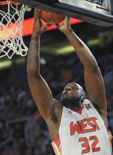 Shaquille O'Neal slams dunk in the NBA's annual All-Star Game on Sunday.