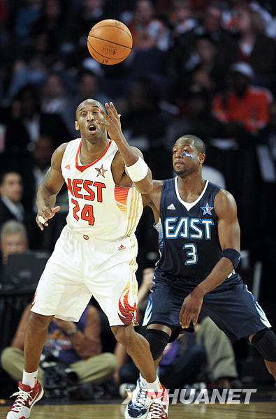 Kobe Bryant (R) scored a game-high 27 points to lead a rampant West to a 146-119 victory over the East in the NBA's annual All-Star Game on Sunday.