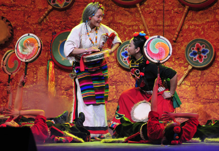 Tibetan artists in traditional costumes stage Tibetan dance during a rehearsal for the grand party scheduled to open on Feb. 24 to celebrate the upcoming Tibetan New Year, the year of Ox, in Lhasa, capital of sotuhwest China's Tibet Autonomous Region, Feb. 14, 2009. [Jia Lijun/Xinhua] 