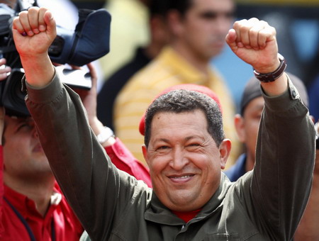 Venezuelan President Hugo Chavez greets supporters after casting during a referendum in Caracas February 15, 2009. Venezuelans [China Daily/Agencies]