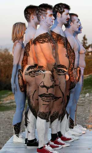 Body-painted performers stand in formation to depict the face of U.S. President Barack Obama during 'The fall of Athens' performance by Swiss artist Dave at Filopapou hill in Athens Feb. 16, 2009. The ceremony was part of the Art Marathon, which will be travelling around the globe until December 2050. [Xinhua/Reuters]