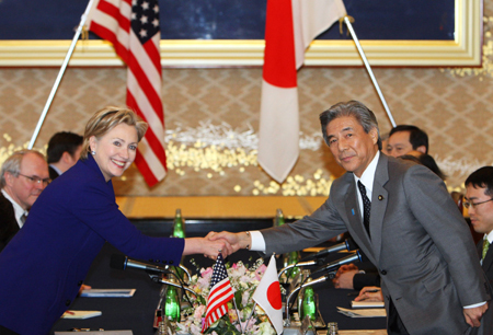 U.S. Secretary of State Hillary Clinton (L) shakes hands with Japanese Foreign Minister Hirofumi Nakasone before their talks in Tokyo Feb. 17, 2009.