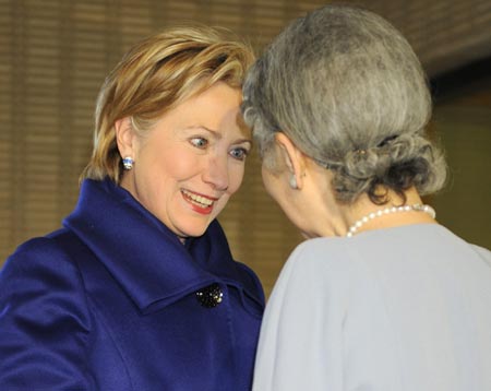 U.S. Secretary of State Hillary Clinton (L) smiles while talking with Japanese Empress Michiko upon Clinton's arrival for a tea party at the Imperial Palace in Tokyo, capital of Japan, Feb. 17, 2009.[Xinhua/Pool] 