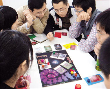 young people playing board games