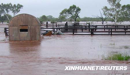 Flood waters pass through stock yards at Yarrarloola Station, a large farm in the Pilbara Region in northern part of Western Australia state in this handout picture received February 18, 2009. [Xinhua/Reuters]