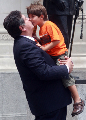 Peruvian President Alan Garcia and his son conceived out of wedlock play at the presidential palace in Lima Feb. 18, 2009.[Xinhua]