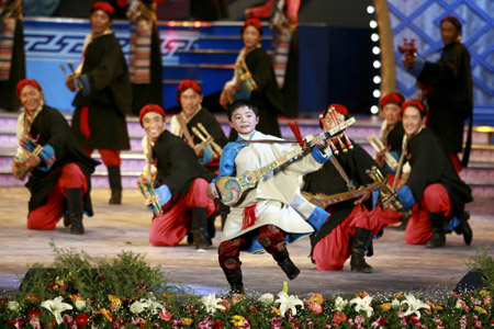 Tibetan actors perform dance at a gala to celebrate the Tibetan New Year in Lhasa, capital of southwest China's Tibet Autonomous Region, Feb. 18, 2009. A grand gala, featuring with typical Tibetan dancing and singing, was held here on Wednesday, to celebrate the upcoming Tibetan New Year, which falls on Feb. 25 this year. [Zhu Wei/Xinhua]