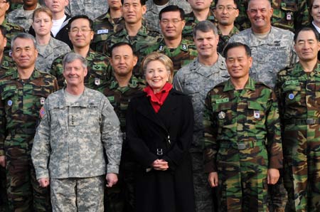 U.S. Secretary of State Hillary Clinton (C, 1st row) poses for photos with Gen. Walter Sharp (1st L, 1st row), the commander of U.S. Forces Korea, and officers during her visit at Yongsan Garrison in Seoul, on Feb. 20, 2009. [Xinhua]