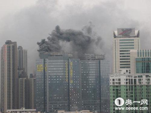 A skyscraper in Guangzhou city caught fire this morning. Smoke can be seen 10 km away