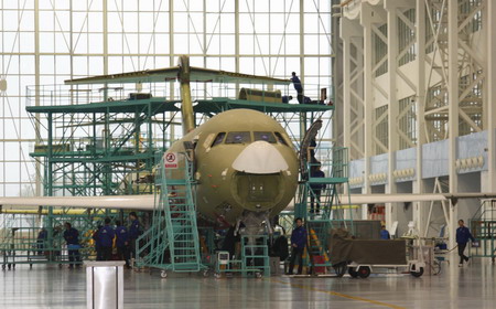 An ARJ21 jet, developed by the state-owned Commercial Aircraft Corporation of China (CACC), is assembled in Shanghai, Februray 19, 2009. CACC has begun mass production of the country's first domestically developed regional jet ARJ21 for 208 orders from foreign and domestic customers. [Xinhua]
