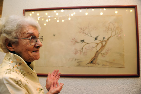 Fanya Pines, 86, introduces one of her paintings during an exhibition in Jerusalem, Feb. 19, 2009. 