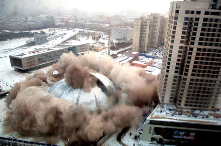 A water amusement center called 'The Summer Palace' falls in a demolition blast in Shenyang, Northeast China's Liaoning province, Feb. 20, 2009. The landmark dome structure was dismantled to make way for construction of a new property development after serving 15 years as a fun place for local residents.