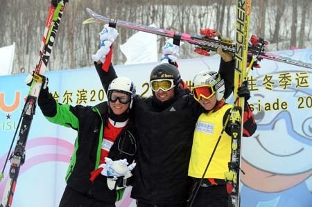 Gold medalist Antoine Galland of France (C), silver medalist Andreas Tischendorf of Germany (L) and bronze medalist Manuel Eicher of the Switzerland gesture during the awarding ceremony of men's ski cross of freestyle skiing at the 24th World Winter Universiade in the Yabuli Ski Resort, 195km southeast away from Harbin, capital of northeast China's Heilongjiang Province, Feb. 20, 2009. 