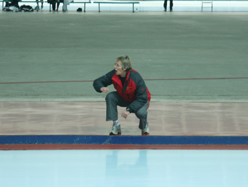 Sijtje cheers for Yu Fengtong during his men's 100 meters final on February 21, 2009.