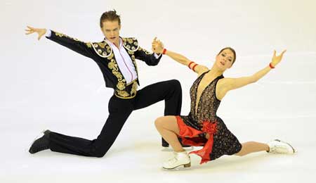 Carolina Hermann (R) of Germany dances with her partner Daniel Hermann during the compulsory dance competition of ice dancing in figure skating in the 24th World Winter Universiade at Harbin International Conference, Exhibition and Sports Center Gym in Harbin, capital of northeast China&apos;s Heilongjiang Province, Feb. 21, 2009. Carolina Hermann and Daniel Hermann took the 7th place with 28.35 points after the compulsory dance. 