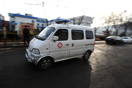 An ambulance arrives at a coal mine in north China's Shanxi Province, Feb. 22, 2009. 