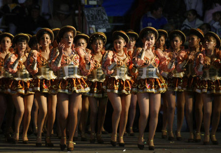 Members Of Caporales 'ENAF' perform during the Carnival parade in Oruro, some 200 km (124 miles) south of La Paz, February 21, 2009. [Xinhua/Reuters]