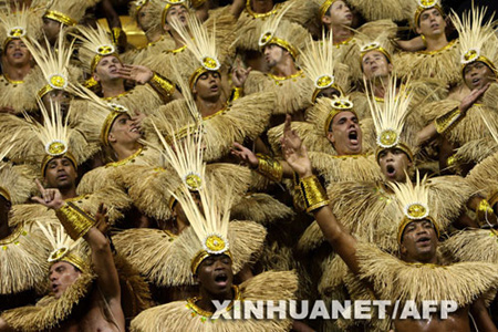  Revelers of Tom Maior samba school parade atop of a float at the Sambadrome, as part of Carnival celebrations, in Sao Paulo, Brazil, on Friday, Feb.20, 2009. [Xinhua/AFP]