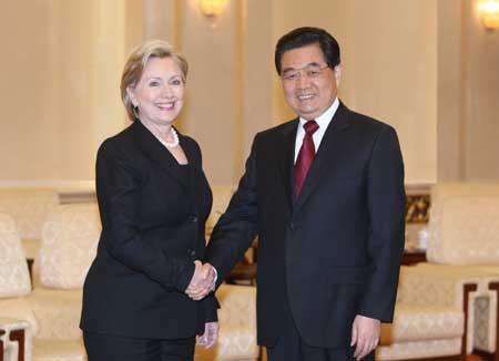 Chinese President Hu Jintao (R) meets with visiting U.S. Secretary of State Hillary Clinton (L) in Beijing, China, Feb. 21, 2009.(Xinhua/Yao Dawei) 