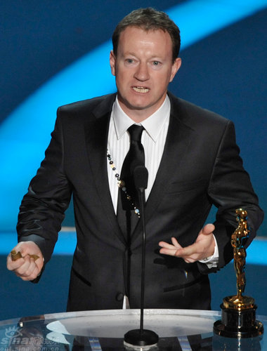 Simon Beaufoy wins Oscar for best adapted screenplay of 'Slumdog Millionaire.' 