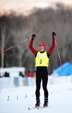 Hatakeyama Chota of Japan jubilates after 3X5km cross country of Nordic Combined team competition in the 24th World Winter Universiade at the Yabuli Ski Resort 195km southeast away from Harbin, capital of northeast China's Heilongjiang Province, Feb. 22, 2009. Japan won the title. Wang [Jianwei/Xinhua]
