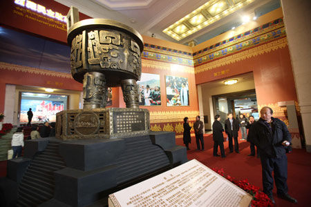 People visit an exhibition marking the 50th anniversary of the Democratic Reform in Tibet Autonomous Region in Beijing, China, Feb. 24, 2009. [Xinhua]