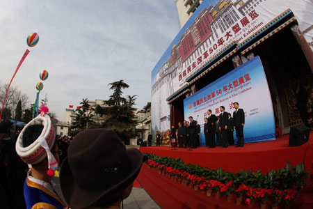 People take part in the opening ceremony of an exhibition marking the 50th anniversary of the Democratic Reform in Tibet Autonomous Region in Beijing, China, Feb. 24, 2009. [Xinhua] 