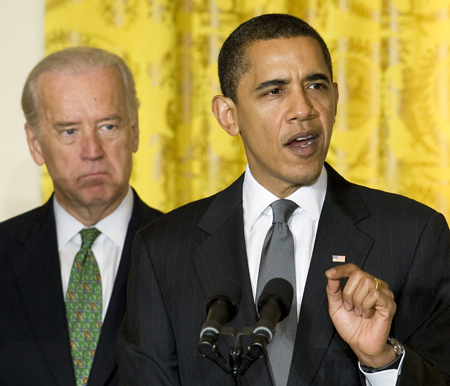 U.S. President Barack Obama (R) speaks next to Vice President Joseph Biden at the U.S. Conference of Mayors in the East Room of the White House in Washington February 20, 2009.