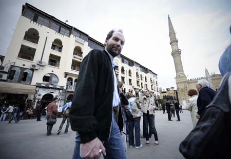  Tourists are seen between the al-Hussein mosque and the Khan al-Khalili bazaar in Cairo, capital of Egypt, Feb. 23, 2009. Shops and restaurants around the Hussein mosque square and in the Khan Al-Khalili bazaar reopened for business on Monday, although two bombs blew up Sunday evening in this populous district, which had killed a French tourist and injured 24. [Zhang Ning/Xinhua]