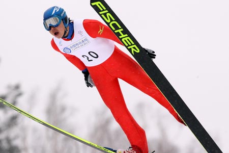 Nagai Takehiro of Japan competes during the K90m ski jumping of Nordic combined mass start competition in the 24th Winter Universiade at the Yabuli Ski Resort 195km southeast away from Harbin, capital of northeast China's Heilongjiang Province, Feb. 24, 2009. Nagai Takehiro won the silver of the mass start event with 224.9 points. (Xinhua Photo) 