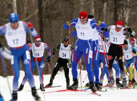 Sato Koichiro(L3) of Japan competes during the 10km cross country race of Nordic combined mass start competition in the 24th Winter Universiade at the Yabuli Ski Resort 195km southeast away from Harbin, capital of northeast China's Heilongjiang Province, Feb. 24, 2009. Sato Koichiro won the title of the mass start event with 227.7 points. (Xinhua Photo) 