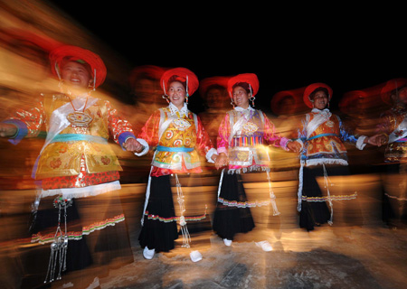 Tibetan residents perform the Tibetan Bonfire Dance, also known as the dance of "Guozhuang", the traditional greeting dance of Tibetan and Qiang ethnic groups around the campfire, in Tibetan autonomous prefecture of Diqing, southwest China