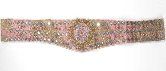 A custom pink and gold brocade fabric belt embellished with rhinestone banding and faceted pink, gold and irredescent square crystals with round gold beaded spray design. Label on the back reads &apos;Bill Whitten MJ&apos;. Estimate: $200 - $300 [China.org.cn/Julien&apos;s Auctions/Shaan Kokin] 