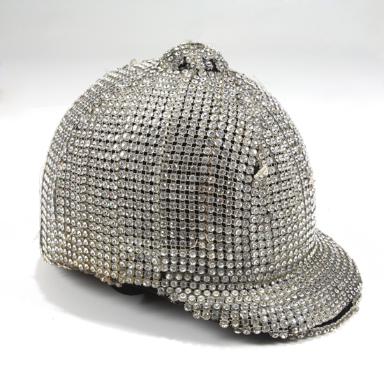 A customized rhinestone covered equestrian hat, worn by Michael Jackson during the 1981 Triumph tour with The Jacksons. The black velvet hat has been completely covered in rhinestone banding. Estimate: $300 - $500 [China.org.cn/Julien's Auctions/Shaan Kokin] 