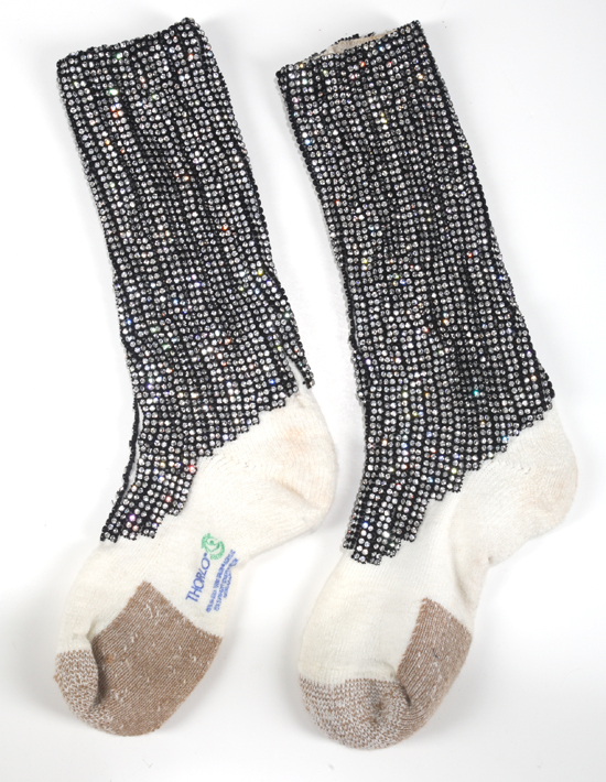 A pair of acrylic tube socks custom designed with uppers covered in rhinestone banding. These signature pieces date to the era of Jackson's 1981 Triumph tour with The Jacksons. Estimate: $600 - $800 [China.org.cn/Julien's Auctions/Shaan Kokin] 