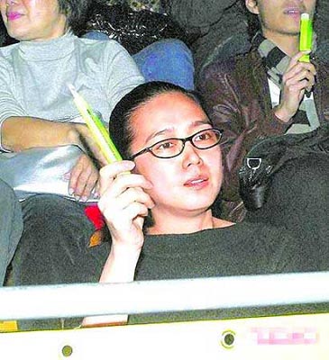 This undated photo shows Ms Carol Zhu attended a vocal concert of Andy Lau. 