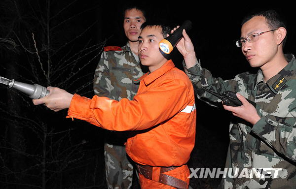 Firefighters were fighting the fire in Longjiashan National Forest Park in Longli County, Guizhou Province February 25, 2009. 