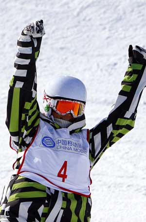 China's Liu Jiayu gestures during the women half pipe final of snowboarding at the 24th World Winter Universiade at the Maoershan Ski Resort in Maoershan Town, 85km southeast from Harbin, capital of northeast China's Heilongjiang Province, Feb. 25, 2009. Liu won the gold medal with 46.7 points. (Xinhua Photo) 