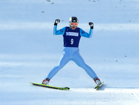 Kim Hyun Ki of South Korea reacts during the normal hill ski jumping team event (K90) in the 24th World Winter Universiade at the Yabuli Ski Resort 195km southeast away from Harbin, capital of northeast China's Heilongjiang Province, Feb. 25, 2009. The team of South Korea claimed the title of the event with a total of 726.5 points. (Xinhua Photo) 