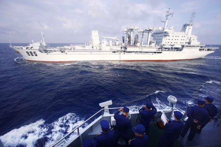 China's missile destroyer 'Guangzhou' (Front) sails towards the comprehensive supply vessel 'Nancang', on the South China Sea, south China, Feb. 24, 2009. Destroyer 'Guangzhou' got its first supplies from 'Nancang' on Tuesday. A Chinese task force, including destroyer 'Guangzhou', will take part in the 'Peace-09' multinational naval exercise in the seas off Pakistan in March. 