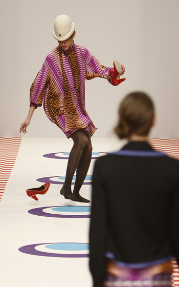 A model's shoes fall off as she presents a creation from the Eley Kishimoto 2009 Autumn/Winter collection during London Fashion Week February 22, 2009.