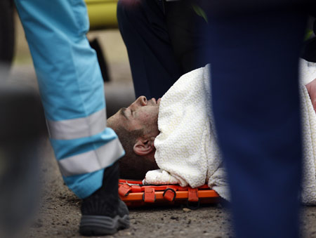 A passenger of a Turkish Airlines passenger plane which crashed while attempting to land receives first aid at Amsterdam's Schiphol airport Feb. 25, 2009. 