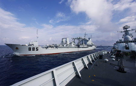 China's destroyer 'Guangzhou' (R) gets supplies from the comprehensive supply vessel 'Nancang', on the South China Sea, south China, Feb. 24, 2009. 