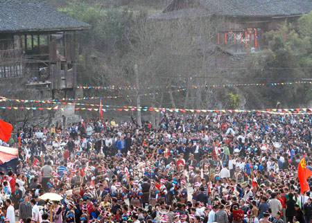 People take part in a gathering in Nangao Village of Danzhai County, southwest China&apos;s Guizhou Province, Feb. 24, 2009. An annual traditional festival was held here from Jan. 25 to 30 in the Chinese lunar calendar, in which people of Miao ethnic group gathered to sing and dance, greeting the coming of spring and ploughing.