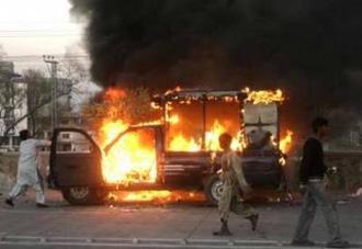 Protesters of the Pakistan Muslim League (N) torch vehicles during a protest against the Supreme court's decision to exclude former Pakistan premier Nawaz Sharif and his brother from elected office, in Lahore February 26, 2009. [Faisal Mahmood/CCTV/REUTERS]